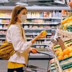 woman-in-yellow-tshirt-and-beige-jacket-holding-a-fruit-3962285 (1)
