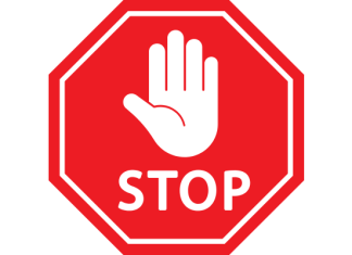 stop sign with palm of hand showing