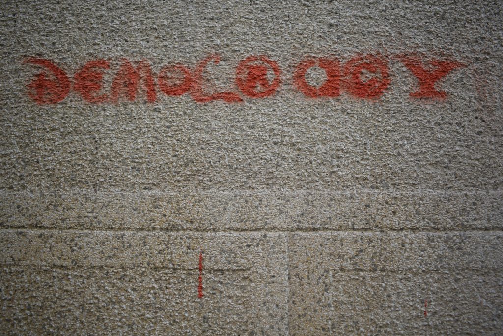 grafitti saying "democracy"